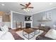 Stylish living room with gray shiplap walls, modern fireplace, and a plush white rug at 11410 Sea Side Dr, Fishers, IN 46040