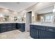 Luxurious primary bathroom featuring dual vanities with modern lighting and plenty of storage at 11410 Sea Side Dr, Fishers, IN 46040