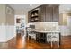 A dedicated desk space features custom built-in cabinets in the office area, with hardwood floors at 11410 Sea Side Dr, Fishers, IN 46040