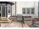 Modern outdoor kitchen featuring stainless steel grill, sink, storage, and stone counter, perfect for outdoor entertaining at 11410 Sea Side Dr, Fishers, IN 46040