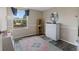 Bedroom with wood-look floors, a large window, and a dresser at 1206 Rosengarten Dr, Greenwood, IN 46142
