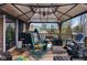 Enjoy the covered deck area with seating and outdoor space at 1206 Rosengarten Dr, Greenwood, IN 46142