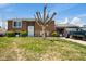 Split-level home featuring brown siding, an attached garage and a lawn at 1206 Rosengarten Dr, Greenwood, IN 46142