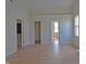 Bright bedroom with a large window and several closets, complete with light wood-look flooring at 12326 River Valley Dr, Fishers, IN 46037