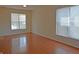 Spacious living room featuring gleaming hardwood floors and a large window for ample natural light at 12326 River Valley Dr, Fishers, IN 46037