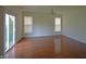 Bright living room with hardwood floors, sliding glass doors, and neutral paint at 12326 River Valley Dr, Fishers, IN 46037