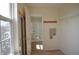Open walk-in closet leads to bathroom with tiled floor and natural light from window at 12326 River Valley Dr, Fishers, IN 46037