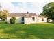 Well-kept backyard showcasing a green lawn and the rear view of the single-Gathering home at 126 Mercator Dr, Greenwood, IN 46143