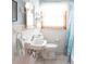 Cozy bathroom with white tiled walls and traditional fixtures, plus a bright window at 126 Mercator Dr, Greenwood, IN 46143