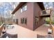 Rear exterior showcasing a spacious deck, offering seamless indoor-outdoor living and backyard views at 13306 W 50 S, Columbus, IN 47201