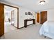 Bright bedroom boasts neutral decor, wall art, carpeted floors, and a unique console table for added style at 13306 W 50 S, Columbus, IN 47201