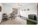 Well-lit bedroom showcases a desk, a window providing natural light, and a comfortable rowing machine at 13306 W 50 S, Columbus, IN 47201