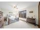 Charming bedroom featuring a large window with outdoor views, a metal bed frame, and cozy decor at 13306 W 50 S, Columbus, IN 47201