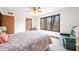 Bright bedroom with a large window offering wooded views, creating a serene and inviting space at 13306 W 50 S, Columbus, IN 47201