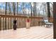 Wide wooden deck adorned with decorative elements and seating, enhancing the outdoor living experience at 13306 W 50 S, Columbus, IN 47201