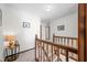 Hallway with wood trim and neutral carpet shows access to multiple rooms at 13306 W 50 S, Columbus, IN 47201