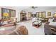 Cozy living room with fireplace, large windows, and comfortable seating at 13306 W 50 S, Columbus, IN 47201