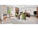 Bright living room features a full brick fireplace, bar seating, and modern decor at 13306 W 50 S, Columbus, IN 47201