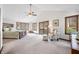 Spacious main bedroom with vaulted ceilings, a ceiling fan, and an exterior deck at 13306 W 50 S, Columbus, IN 47201