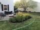 Beautiful backyard with a fire pit and manicured flowerbeds at 14195 Holly Berry Cir, Fishers, IN 46038