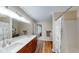 Bright bathroom with double sink vanity, wood flooring, and shower/tub combination at 14195 Holly Berry Cir, Fishers, IN 46038