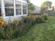 Landscaped garden featuring flowers, and a lawn at 14195 Holly Berry Cir, Fishers, IN 46038