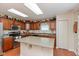 Well-lit kitchen featuring an island and lots of cabinet space at 14195 Holly Berry Cir, Fishers, IN 46038