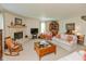Spacious living area featuring a cozy stone fireplace and comfortable seating at 14195 Holly Berry Cir, Fishers, IN 46038