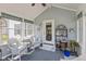 Cozy sunroom with comfortable wicker seating and plenty of natural light, perfect for relaxation at 14195 Holly Berry Cir, Fishers, IN 46038