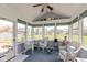 Bright sunroom with vaulted ceiling and wicker furniture, perfect for relaxation at 14195 Holly Berry Cir, Fishers, IN 46038