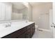 Bathroom featuring tile flooring, a double vanity with white countertops, and a large mirror at 14878 Horse Branch Way, Fishers, IN 46040