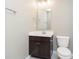 Traditional bathroom featuring a modern vanity with dark wood cabinets, white countertop, and a toilet at 14878 Horse Branch Way, Fishers, IN 46040