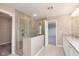 Bathroom showcasing glass-enclosed shower with tile surround and double vanity with granite countertops at 14878 Horse Branch Way, Fishers, IN 46040