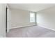 Carpeted bedroom featuring a window and a closet at 14878 Horse Branch Way, Fishers, IN 46040