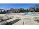 Community pool with lounge chairs, pergola, and ample seating at 14878 Horse Branch Way, Fishers, IN 46040
