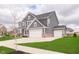 Beautiful house with a 3-car garage, a manicured lawn and mature trees at 14878 Horse Branch Way, Fishers, IN 46040