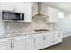 Gourmet kitchen with stainless steel appliances, modern cabinetry, and granite countertops at 14878 Horse Branch Way, Fishers, IN 46040