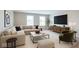 Comfortable living room with large sectional sofa, media console, and neutral decor at 14878 Horse Branch Way, Fishers, IN 46040