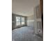 Unfinished bedroom shows bright, natural light streaming through double windows, ready for customization at 14910 Garden Mist Pl, Fishers, IN 46037