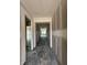 An unfinished hallway with white walls leads to open rooms offering a glimpse of the home's layout at 14910 Garden Mist Pl, Fishers, IN 46037
