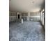 Unfinished living room showing an open layout, recessed lighting, and large windows at 14910 Garden Mist Pl, Fishers, IN 46037