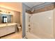 Bathroom with shower and tub combo, white vanity, and neutral walls at 1632 Blankenship Dr, Indianapolis, IN 46217