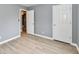 Bedroom featuring neutral colored walls and doors, and durable wood-look floors at 1632 Blankenship Dr, Indianapolis, IN 46217