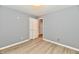 Bedroom featuring durable wood-look floors and ample closet space at 1632 Blankenship Dr, Indianapolis, IN 46217