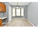 Dining area with bright windows and wood-look flooring at 1632 Blankenship Dr, Indianapolis, IN 46217