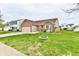 Charming single-Gathering home featuring a well-manicured lawn, brick accents, and an attached two-car garage at 1632 Blankenship Dr, Indianapolis, IN 46217