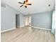 Bright living room with ceiling fan, sliding glass doors and wood-look flooring at 1632 Blankenship Dr, Indianapolis, IN 46217