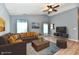 Comfortable living room with warm tones, a ceiling fan, and ample seating space for relaxation at 1632 Blankenship Dr, Indianapolis, IN 46217