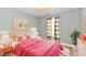 Bright pink bedroom featuring soft lighting, cheerful decor, and a cozy atmosphere at 1632 Blankenship Dr, Indianapolis, IN 46217