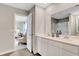 Bright bathroom showcasing double vanity, modern fixtures, and a view into the Primary bedroom at 16930 Sandhurst Pl, Westfield, IN 46074